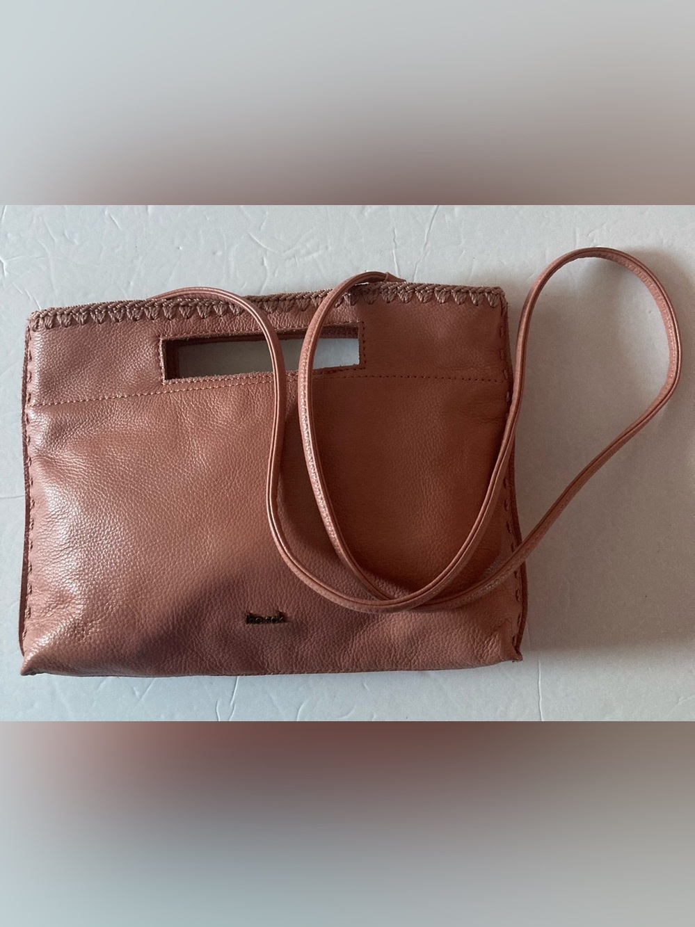 The Sak coral lite pink Leather Cutout-Handle Crossbody Clutch Hand Stitched